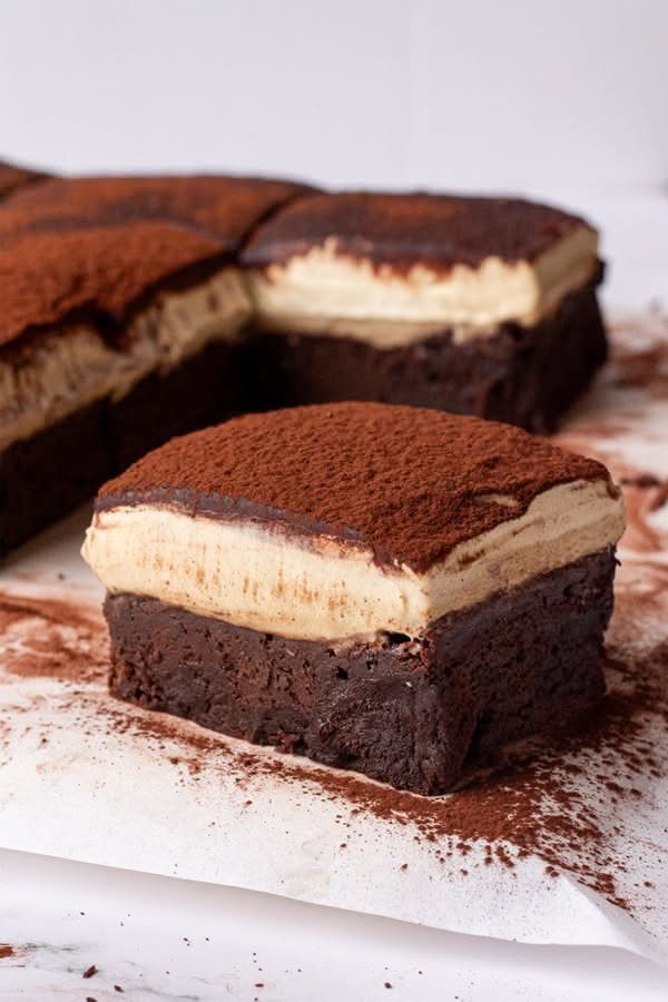 Tiramisu dessert with coffee layers and cocoa powder topping.
