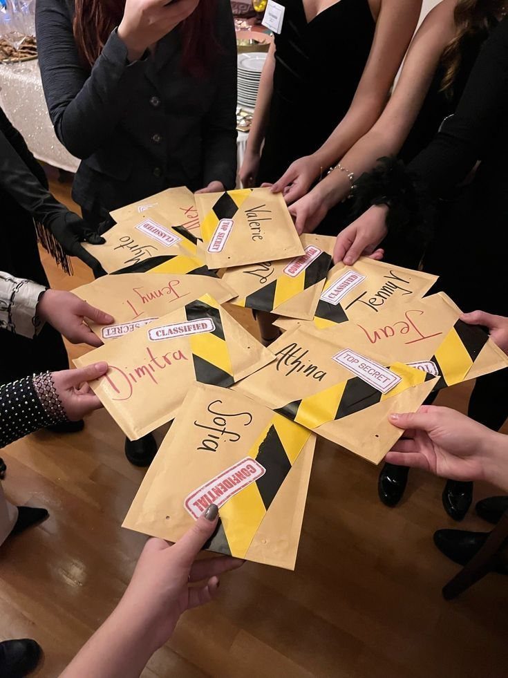 Hands holding manila envelopes with caution stripes and secret labels arranged in a circle.
