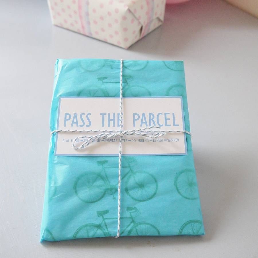 A blue bicycle patterned gift parcel tied with twine and a label.